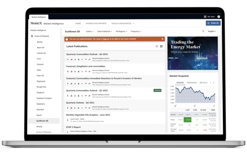 StoneX Market Intelligence website showing market publications and real-time market snapshot on a laptop screen