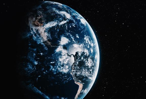 View of Earth from space showing the Americas, surrounded by stars and atmospheric cloud patterns, symbolizing global reach and insight