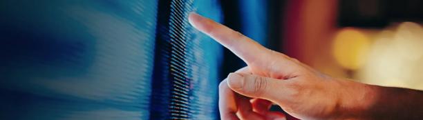Hand interacting with a digital touchscreen display, highlighting technology, data access, user interface navigation, and real time information management