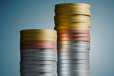 Two stacks of gold, copper, and silver coins on a teal background