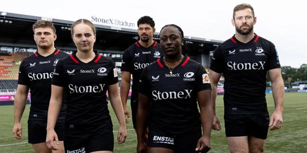 Saracens players standing on pitch