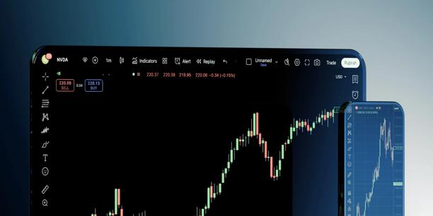 Laptop showing TradingView charts with technical indicators and a strategy panel