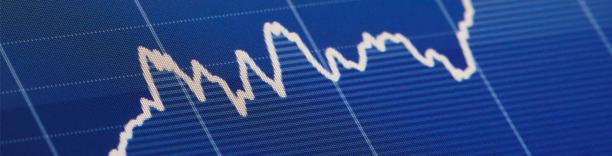 Blue financial chart with jagged lines, symbolizing market volatility and stock market performance