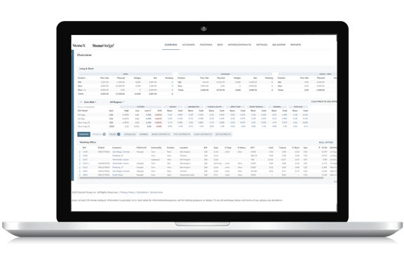 StoneX trading platform displayed on laptop screen with portfolio overview and detailed market data