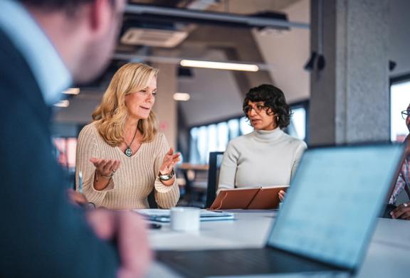 Team of consultants discussing strategy in an office setting