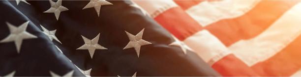 American flag in close-up, symbolizing United States politics, governance, and economy