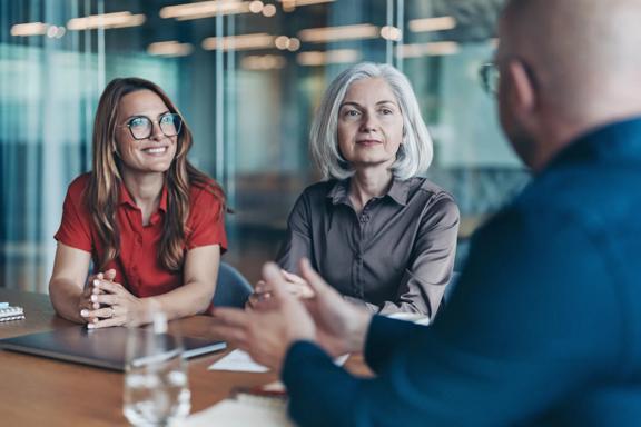 Advisor meeting with clients to review financial goals