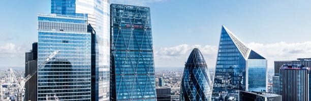 Modern skyscrapers in the City of London including The Gherkin and surrounding glass towers.