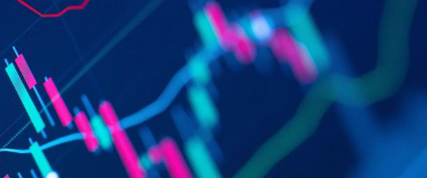 Colorful digital candlestick chart showing stock market trends on a dark background