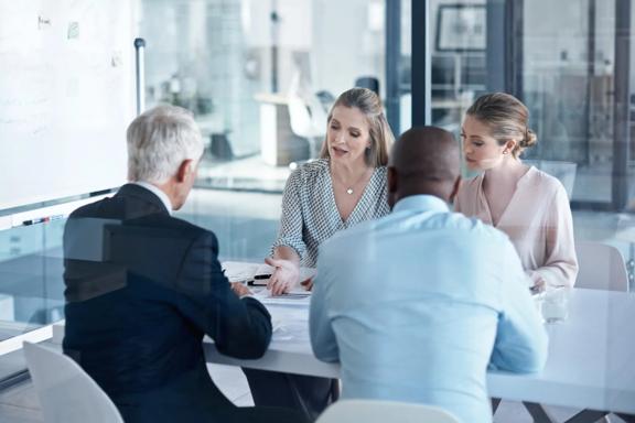 Team of professionals discussing financial strategy
