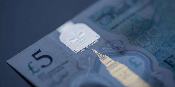 Close-up of a British five-pound banknote with security features