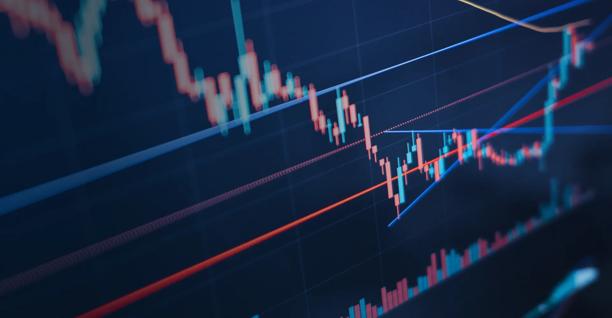 A close-up view of a screen showing a financial candlestick graph