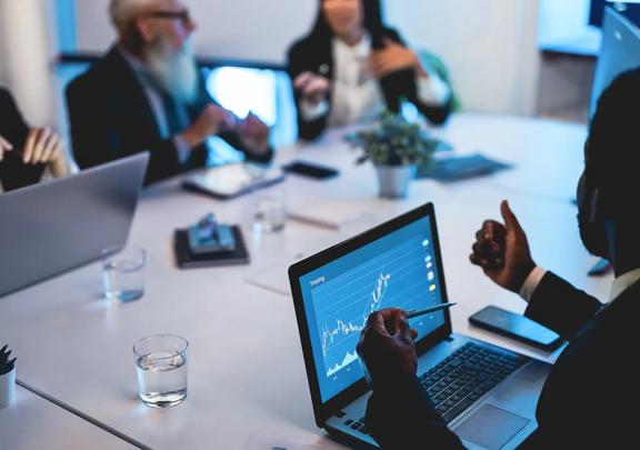 Financial Analysts Discussing Market Trends During Strategy Meeting