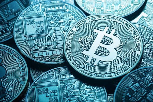Collection of Bitcoin cryptocurrency coins featuring the Bitcoin symbol and circuit style engravings, representing digital assets, blockchain technology, cryptocurrency investing, and virtual currency markets.