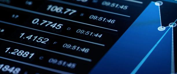 Close-up of digital screen displaying real-time financial data and market prices