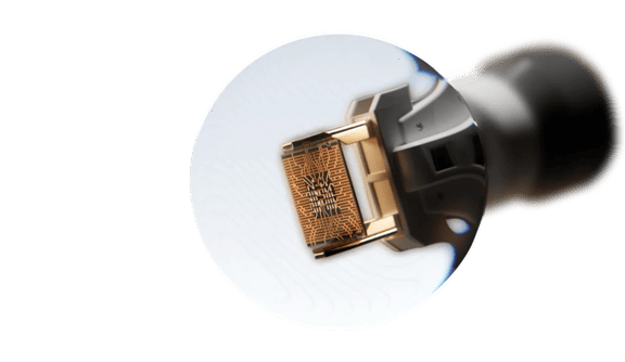 AI microchip held by a robotic tool, symbolizing Anthropic and artificial intelligence innovation.