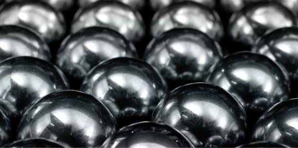 Close-up of polished metal balls used in industrial manufacturing