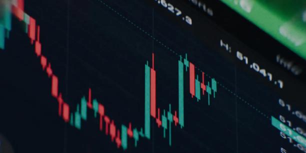 Close-up of a trading platform showing red and green candlestick charts