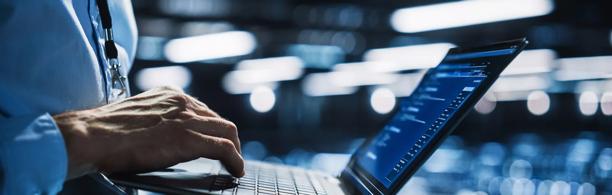Investor using laptop to manage synthetic prime brokerage services