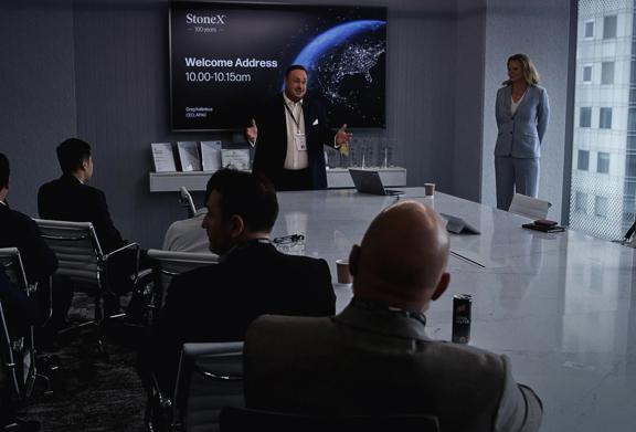 Corporate strategy meeting with presentation screen