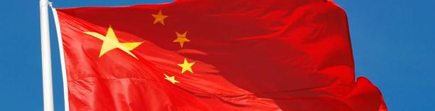 Chinese national flag waving in the wind, symbolizing China’s economy, trade, and geopolitical influence