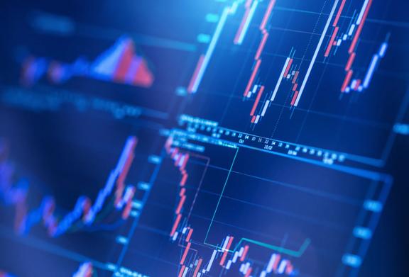 Close-up of multiple financial charts and technical indicators on a digital trading screen