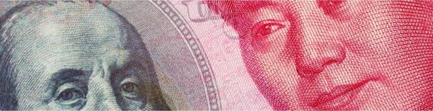 Close-up of US dollar and Chinese yuan banknotes side by side, symbolizing trade tensions and currency markets