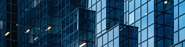 City skyline with reflective glass towers, emphasizing economic development and real estate growth
