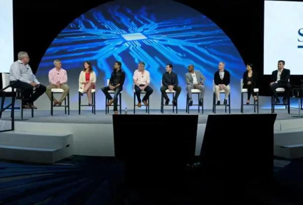 A panel of the StoneX leadership seated on a stage