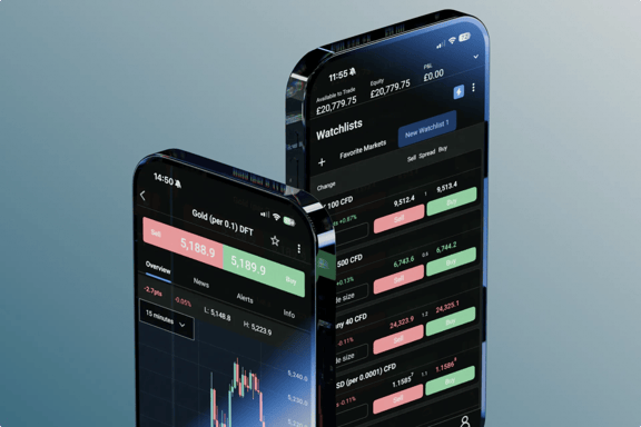 Laptop and smartphone screens showing StoneX Trading platform 