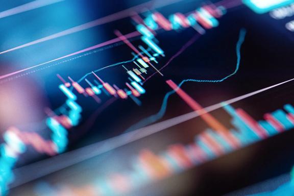 Close-up of a candlestick chart showing financial market data and trends with colorful indicators