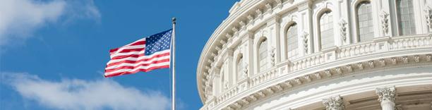 US Capitol building with American flag, symbolizing government, democracy, and national policy