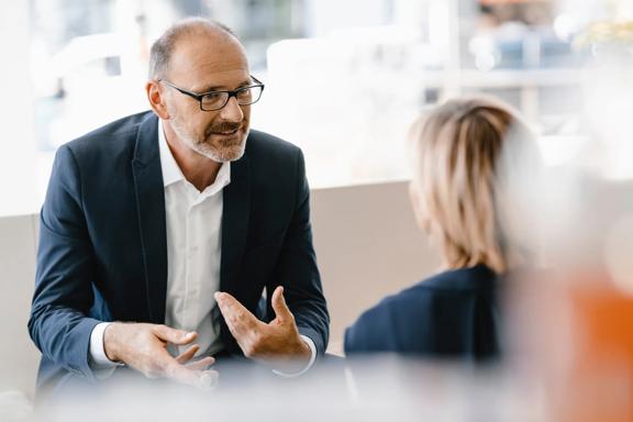 Financial advisor meeting with a client to discuss investment and financial goals