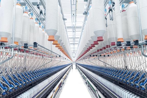 Textile Manufacturing - Spinning Thread in Industrial Factory