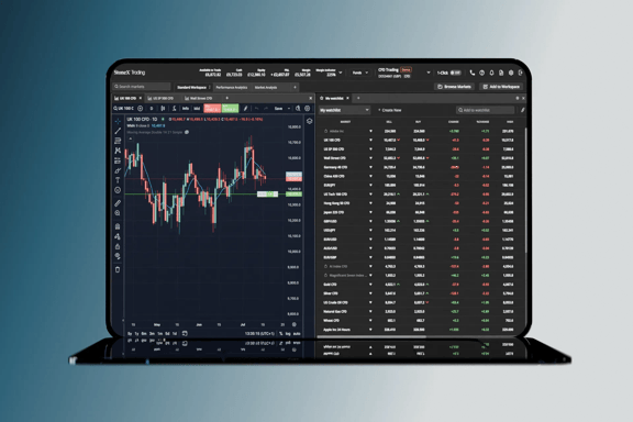 A laptop displaying a trading platform with a market watchlist on the left and a candlestick chart on the right.