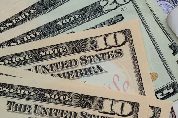 Close-up of overlapping U.S. dollar banknotes.

