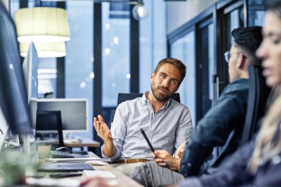 Colleagues discussing strategy in a meeting