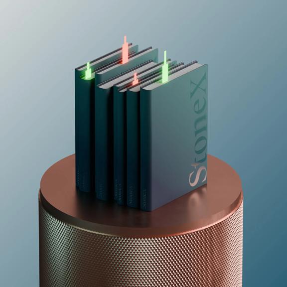 StoneX books on a pedestal with green and red candlesticks poking out the top on a teal background 