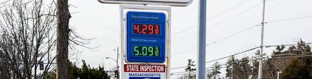 Gas station sign showing fuel prices above $4 and $5 per gallon, representing rising energy costs and inflation impact