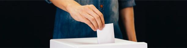Voting ballot box image during election coverage, linking political results with economic and market implications