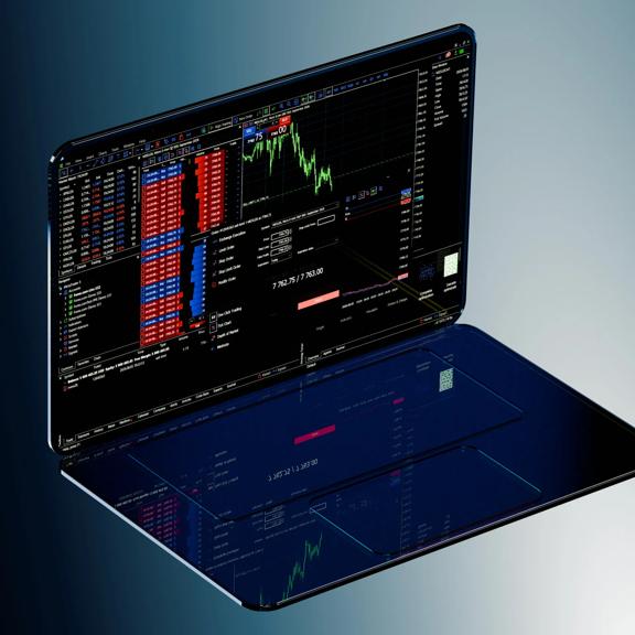 Laptop displaying the MetaTrader 5 platform with depth of market and charting panels