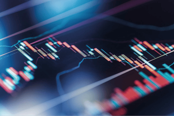 Close up view of a financial trading chart displaying candlestick patterns, market trends, and technical indicators. Digital market analysis graphic illustrating price movements, trading activity, and investment opportunities across financial markets.