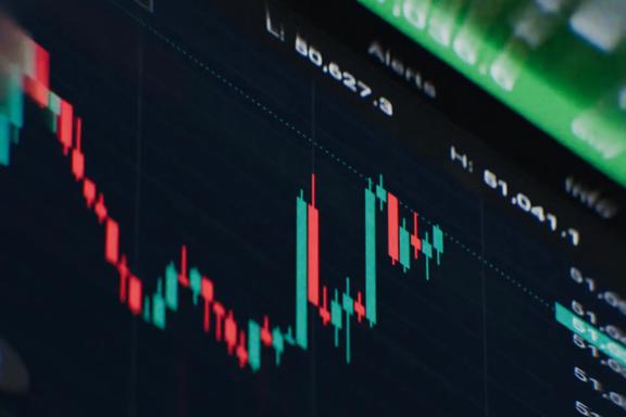 Close up view of a forex trading chart displaying green and red candlesticks, price fluctuations, and market trend movements. Technical analysis chart illustrating currency market activity, trading opportunities, and real time price action.