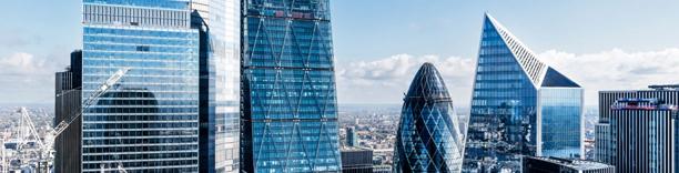 Modern financial district skyline with contemporary office buildings representing banking and institutional financial services.