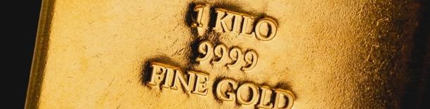 Engraved gold bullion bar marked '1 KILO 999.9 FINE GOLD', representing wealth, bullion reserves, and precious metals trading