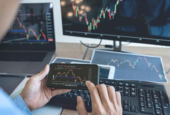 Multiple devices showing financial chart