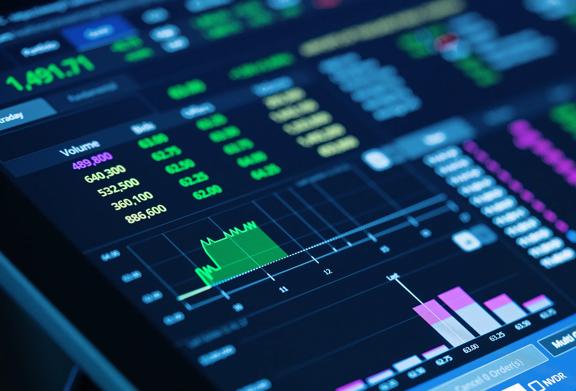 Close-up of digital stock trading dashboard displaying real-time market data, charts, and financial analytics