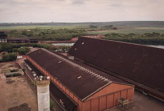 Agricultural buildings with fields in the background