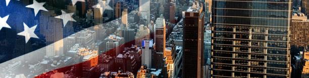 US flag blended with New York City skyscrapers, symbolizing American economy and finance
