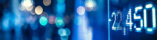 Blurred financial screen with numbers, symbolizing market prices, stock exchange, and trading activity